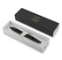 A matte black ballpoint pen in a stylish box, featuring a brand logo on the exterior.