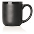 A ceramic mug in matte black with a glossy black trim, featuring a curved handle and a rounded body.
