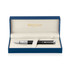 A black Waterman ballpoint pen in a stylish blue and cream box with a logo.