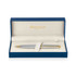 A brushed stainless steel mechanical pen in a blue gift box with a gold clip and interior lining.