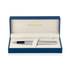 A brushed stainless rollerball pen in a blue gift box with a soft interior and a logo.