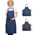 A denim full bib apron in dark blue with a neck strap and front pockets, featuring a logo.
