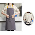 A grey poly-cotton canvas bib apron with a yellow neck strap and front pocket, featuring a branding logo.