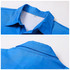 A blue women's 100% cotton sublimated shirt featuring a collar and a label inside the neckline.