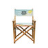 A wooden director's chair in light blue and colourful fabric with a logo on the backrest.