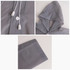 A grey reusable PEVA raincoat featuring a hood, drawstring, and cuff details. It includes a logo on the fabric.