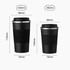 A stainless steel travel coffee mug in black, featuring a ribbed design and a lid. Includes two sizes with specified dimensions. A stainless steel travel coffee mug in black, featuring a ribbed design and a lid. Includes two sizes with specified dimensions.