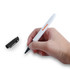 A hand holding a black marker with a white body and a cap beside it, featuring a logo.