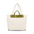 A beige canvas bag with a green leather handle and trim, featuring two long straps for carrying.