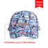 A floral-patterned 6 panel cap featuring a logo, primarily in shades of blue, pink, and black.