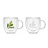 A double wall glass mug in clear, featuring a handle and a logo with green leaves. Two mugs are displayed side by side.