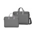 A grey sling laptop bag with a buffer pad, featuring dual handles and an adjustable shoulder strap.