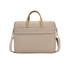 A beige laptop bag with gold handles, featuring a padded compartment and an adjustable shoulder strap.