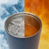 A stainless steel coffee mug in navy blue, showcasing ice on one side and hot beverage on the other.