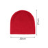 A red beanie hat with a textured finish, measuring 20 cm wide and 21 cm tall, featuring a logo.