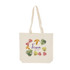 A natural-coloured calico bag with long handles featuring floral designs and a logo.