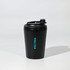 A black travel cup with a lid and a logo, featuring a matte finish.