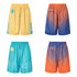Reversible basketball shorts in yellow and teal, and blue and orange, with a logo on each pair.