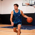 A singlet featuring a blue and black spiral design, worn by a man holding a basketball in a sports hall.