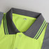 A bright yellow and grey unisex polyester hi-vis reflective short-sleeve polo with a collar and a logo.
