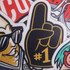 A #1 foam hand in black and yellow, featuring various sporty designs and textures.