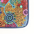 A vibrant, multicoloured laptop bag featuring Aboriginal-inspired dot artwork and a dark blue border.