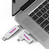 A Twister Type-C flash drive in silver is plugged into a laptop, showcasing a sleek design and branding.