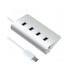A silver USB hub with four ports and a connected white cable. It features a sleek, modern design.