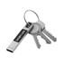 A silver LED flash drive attached to a keyring with several metal keys. The drive has a branding logo.