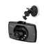 A black dash cam with a lens and a separate suction mount, featuring a logo on the front.