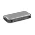 A Bluetooth speaker power bank in black and silver, featuring a textured surface and a logo.