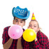 A blue cowboy party hat with branding, worn by two people blowing up pink and yellow balloons, both in checked shirts.