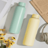 A drink bottle set in mint green and pastel yellow, featuring a simple design with a branded logo.