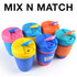 A set of reusable coffee cups in vibrant colors, featuring silicone bands and a secure lid design.