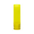 A lip balm stick in a bright yellow container. The packaging includes ingredient information on the bottom label.