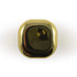 A gold-colored cube of Ritz Cube Lip Balm, featuring a sleek and shiny surface.
