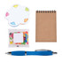 A notepad with a brown cover, a pack of colorful jelly beans, a flower-shaped sticky note pad, and a blue pen.