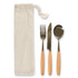 A cutlery set featuring a fork, knife, and spoon with wooden handles, neatly packaged in a natural fabric pouch.