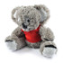 A plush toy koala with gray fur and a red shirt. The toy has a friendly face and plush limbs.