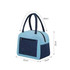 A colourful insulated lunch bag in light blue and navy, featuring two handles and a zippered compartment.