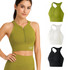 A women's zip-front racerback yoga crop bra tank in olive green, white, and black, featuring a logo.