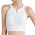 A white zip-front racerback yoga crop bra tank with ribbed texture and a subtle logo.