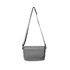 A grey polyurethane shoulder bag with an adjustable strap and a flap closure, featuring a logo.