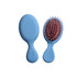A mini paddle brush with a light blue handle and a brown bristle head featuring pink tips. It has a logo.