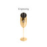 A stainless steel slanted champagne flute in gold, featuring a simple design and a logo on the surface.