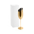 A gold stainless steel slanted champagne flute next to a plain white box, featuring a sleek, modern design.