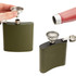 A stainless steel mini funnel is placed on a green flask, with liquid being poured from a bottle.
