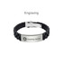 A black silicone bracelet featuring a metal clasp and engraved silver plate, with a logo present.