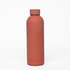 A drink bottle in a matte terracotta finish, featuring a double wall design and a discreet logo.