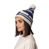 A striped blue and cream Pom Pom Beanie Hat with a fluffy pom pom on top and a small logo.